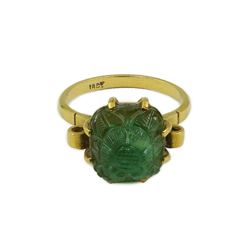 A mid 20th century 18ct gold and single stone emerald set ring